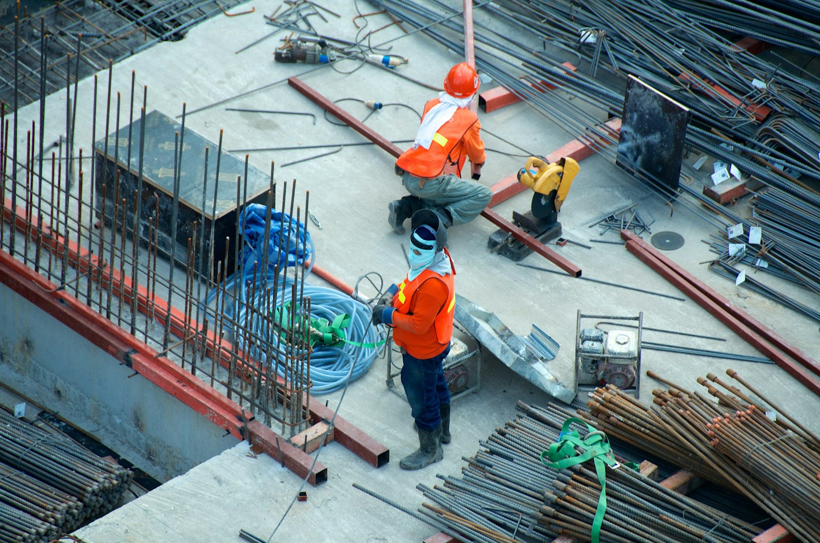 Construction workers in safety gear on site